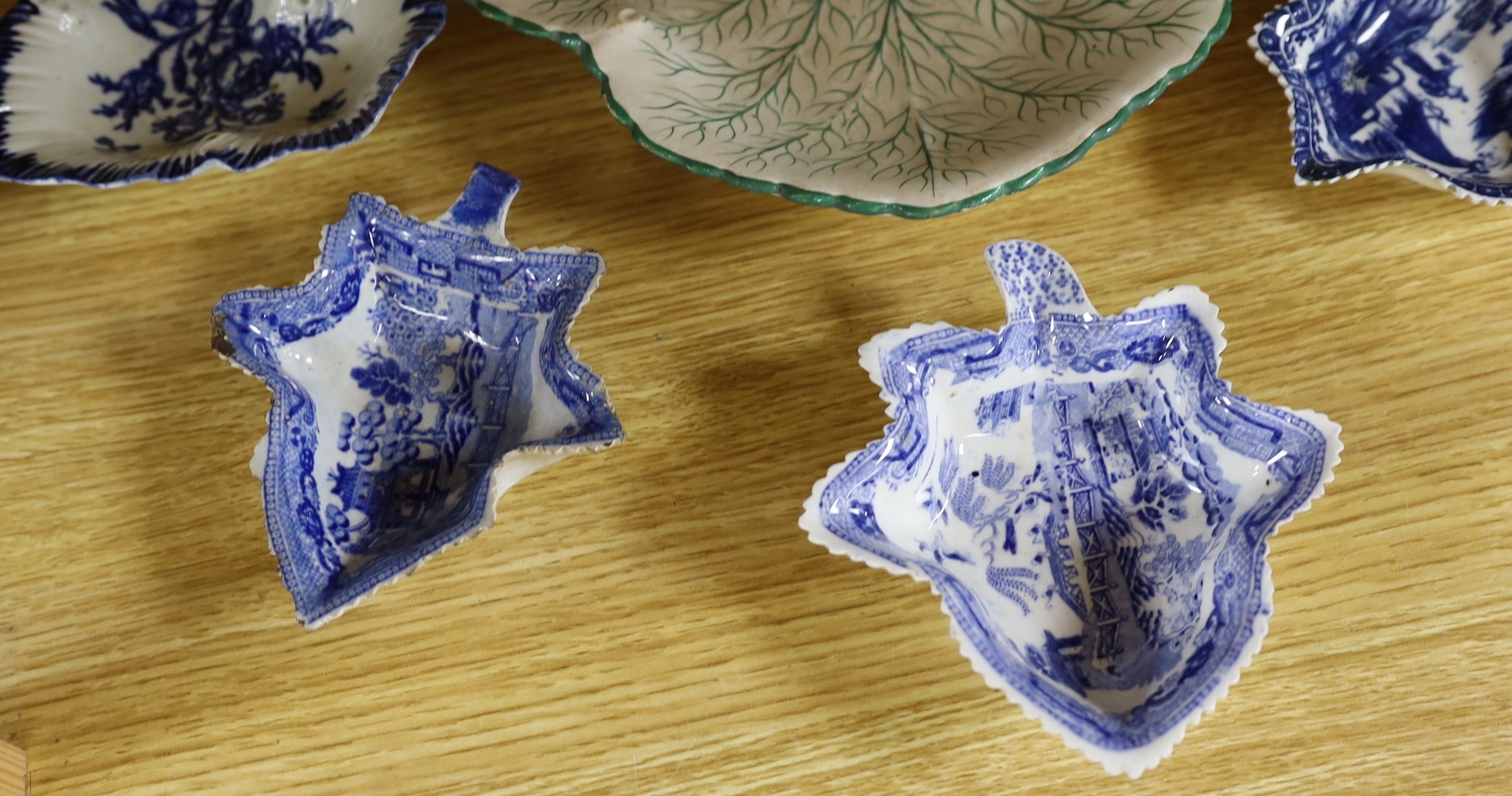 A group of late 18th century Liverpool porcelain leaf pickle dishes, and later pearlware leaf dishes